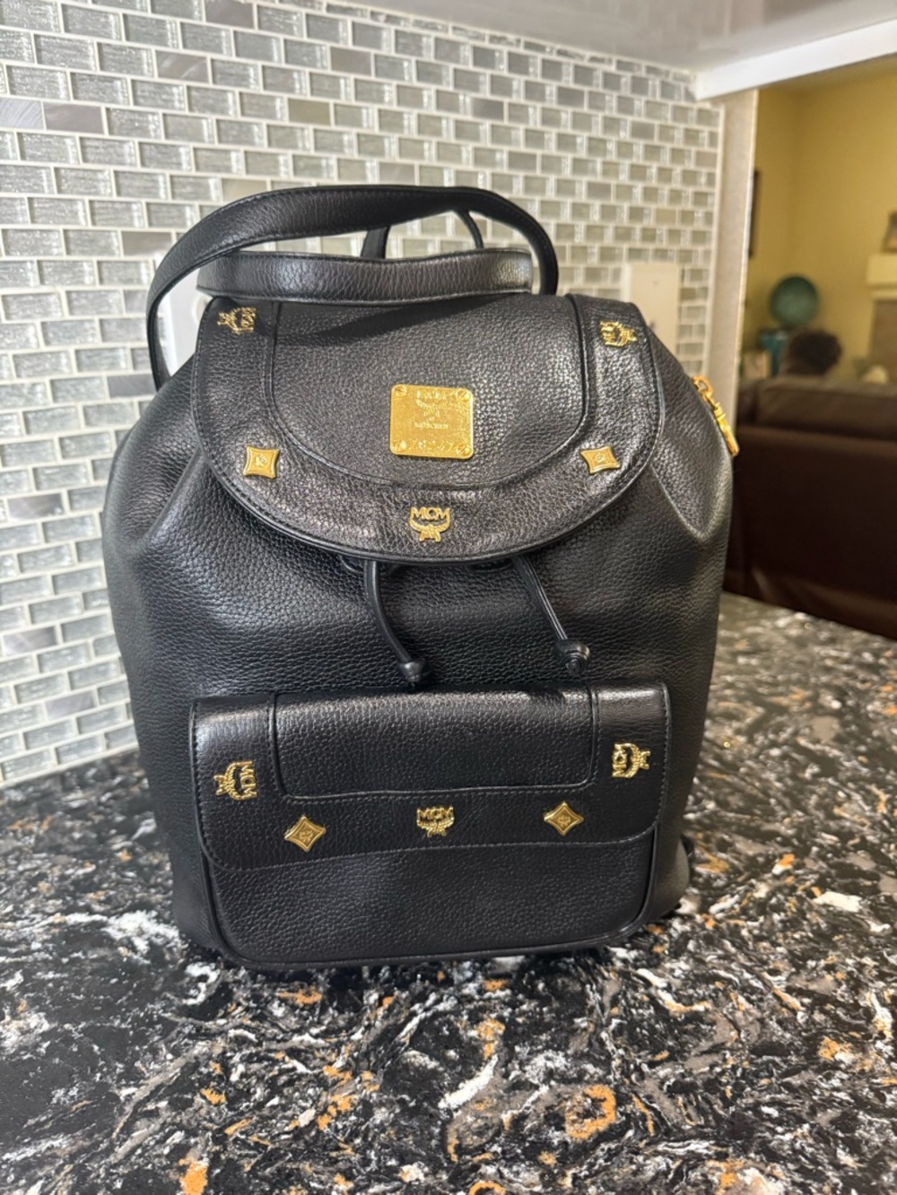 MCM Black Leather Drawstring Backpack with Gold Hardware